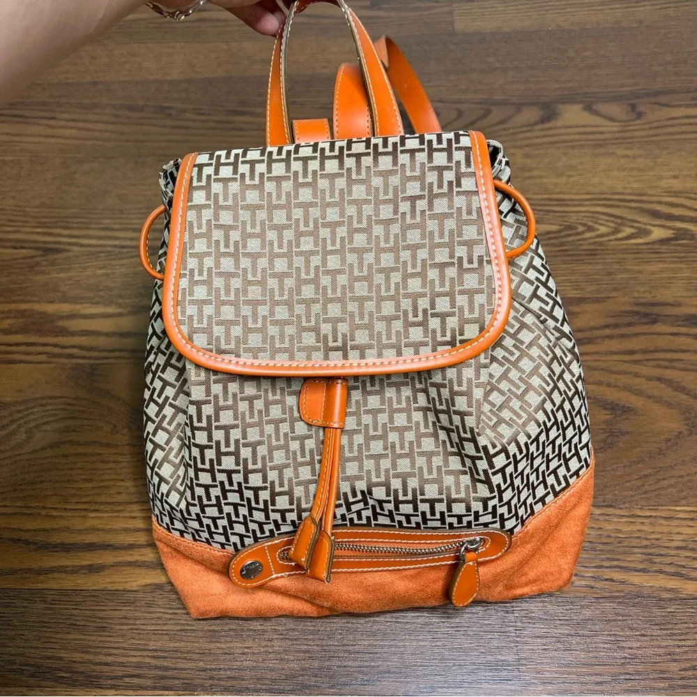 Tommy Hilfiger backpack in orange and brown with a monogram logo print